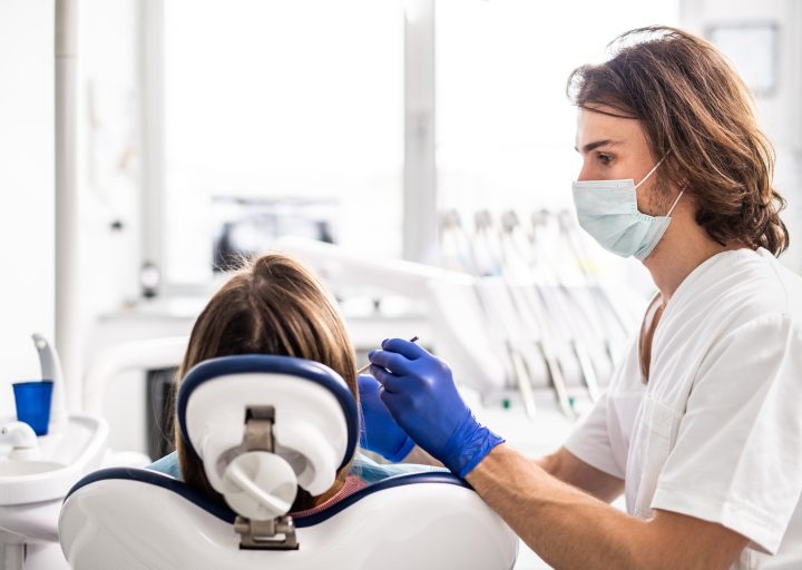 a-dental-check-up-of-patient-in-dentist-surgery.jpg