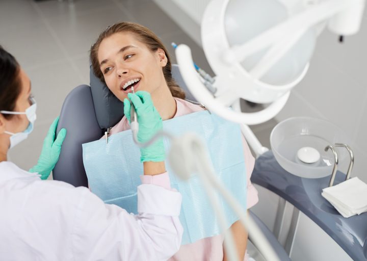 young-woman-at-dental-exam.jpg